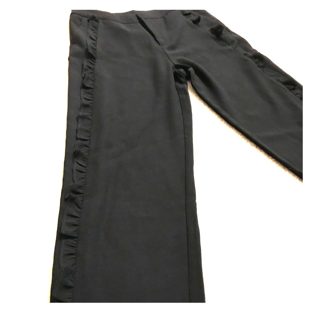 Pants with ruffle embellishments